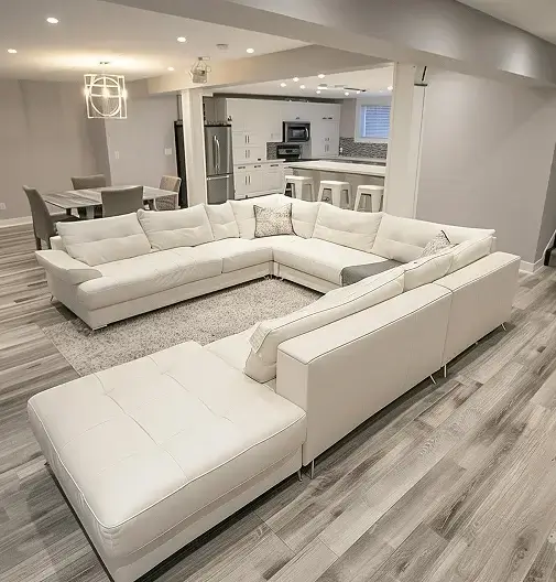 renovated-basement-white-sofa-gray-wood-floor-contemporary-design